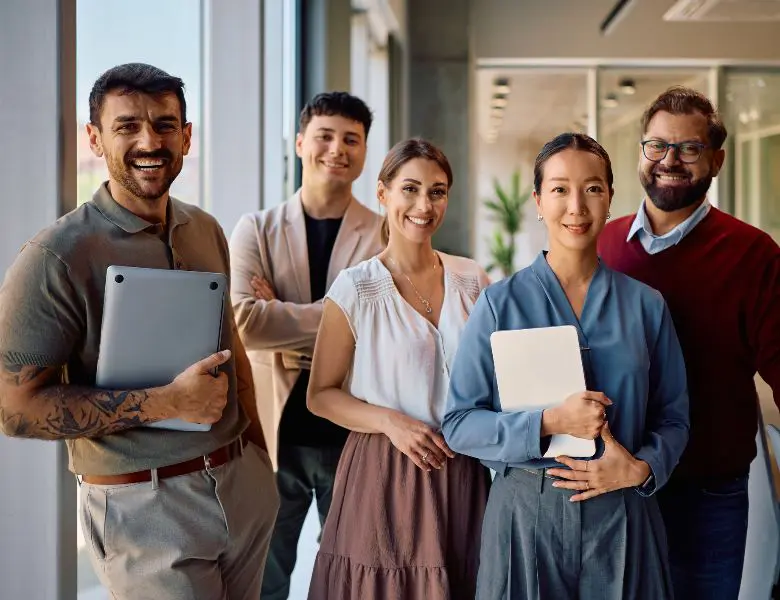 Colleagues posing in modern workspace