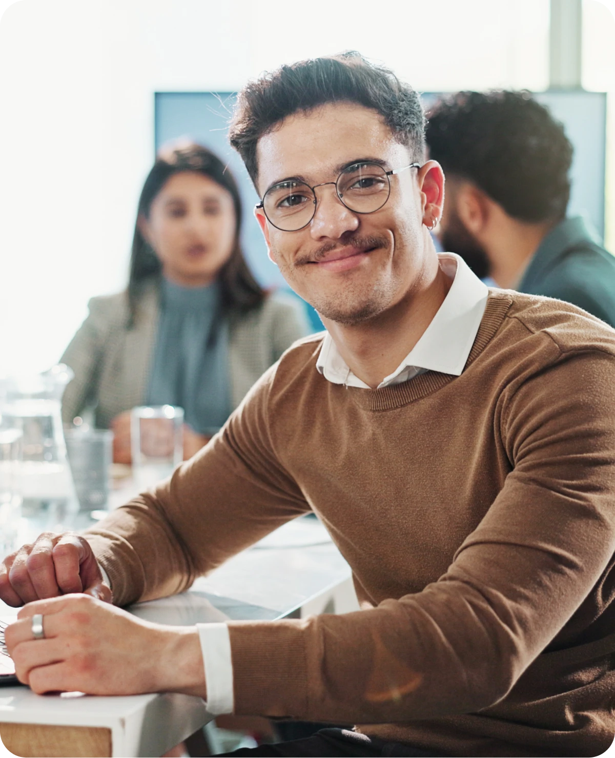 Man smiling in a meeting